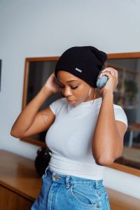 Woman listening intently on headphones