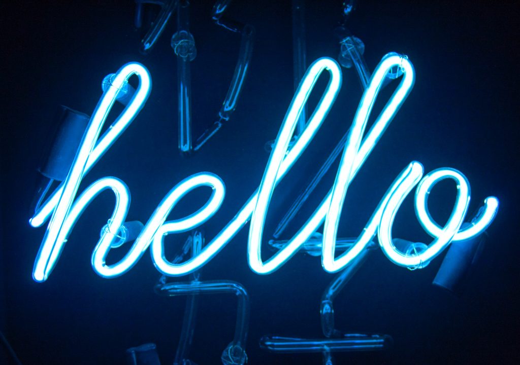 Neon letters spell "hello"